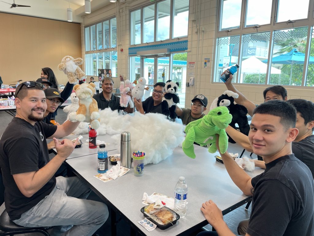 students stuffing animal plushies for build-a-plushie event